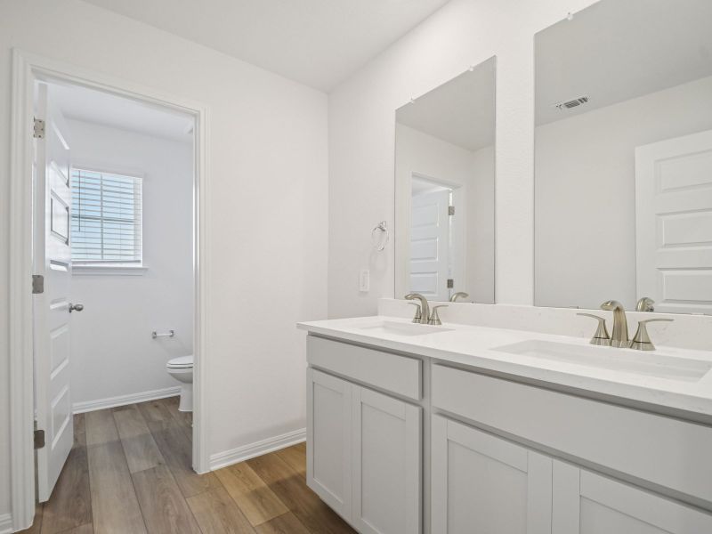 Furnished interior view inside a new home in Riverbend at Double Eagle - Boulevard Collection, Cedar Creek (Image 6).