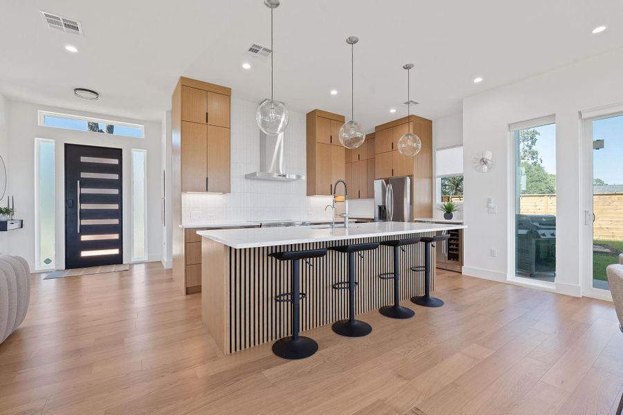 Modern finishes meet everyday function, oversized island seating and seamless flow to dining and views. Modern finishes meet everyday function, oversized island seating and seamless flow to dining and views.