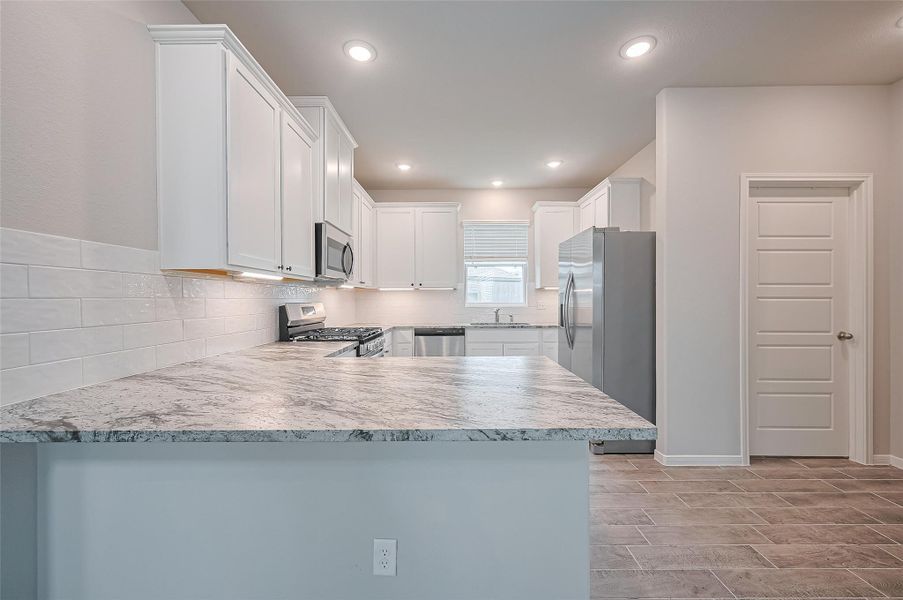 Furnished interior view inside a new home in Sunterra, Katy (Image 12).