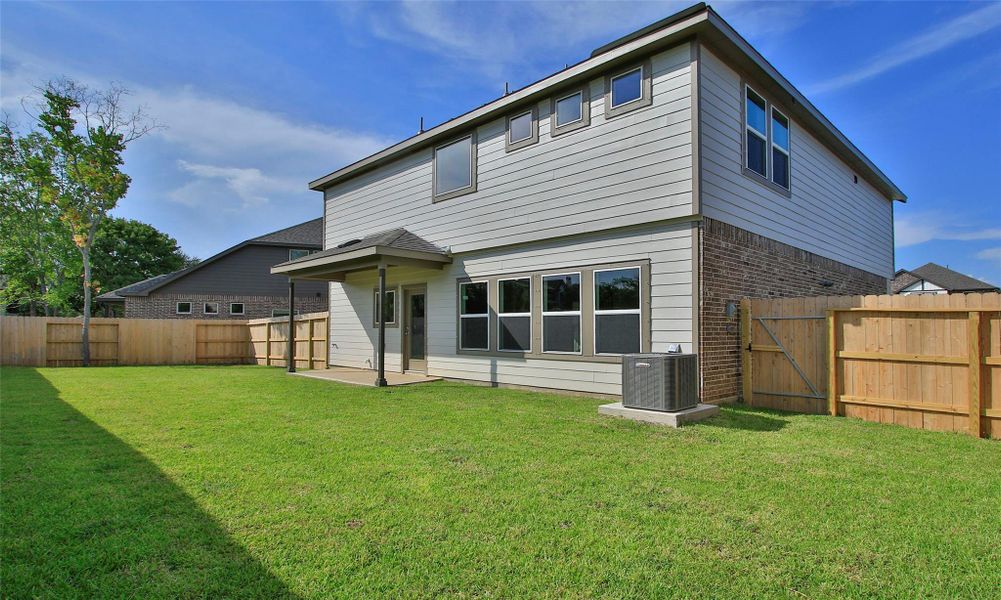Front exterior of a new home in Ellis Cove, Seabrook, TX, highlighting curb appeal (Image 2).
