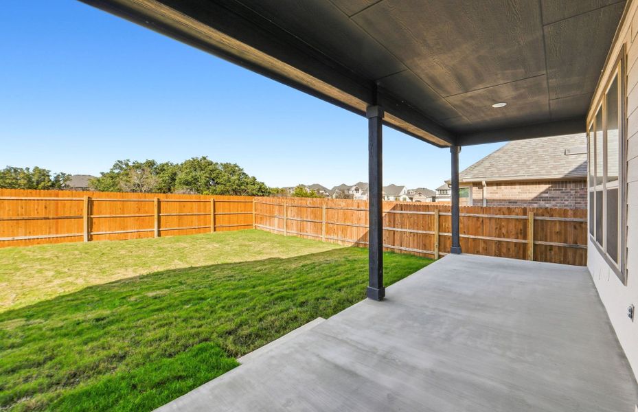 Exterior details and patio area of a home in Saddleback at Santa Rita Ranch, Liberty Hill (Image 27).