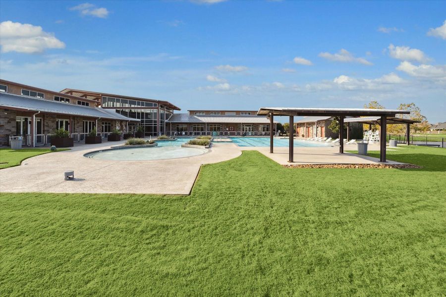 The Farmhouse pool gives Harvest Green residents a resort-style place to relax, cool off, and enjoy sunny days close to home. With open lawn space, covered gathering areas, and inviting community amenities, everyday living here feels easy, social, and fun.
