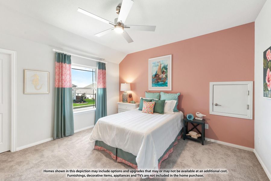 Bedroom with pink accent wall, ceiling fan, carpet flooring, and a queen bed with teal and coral decor