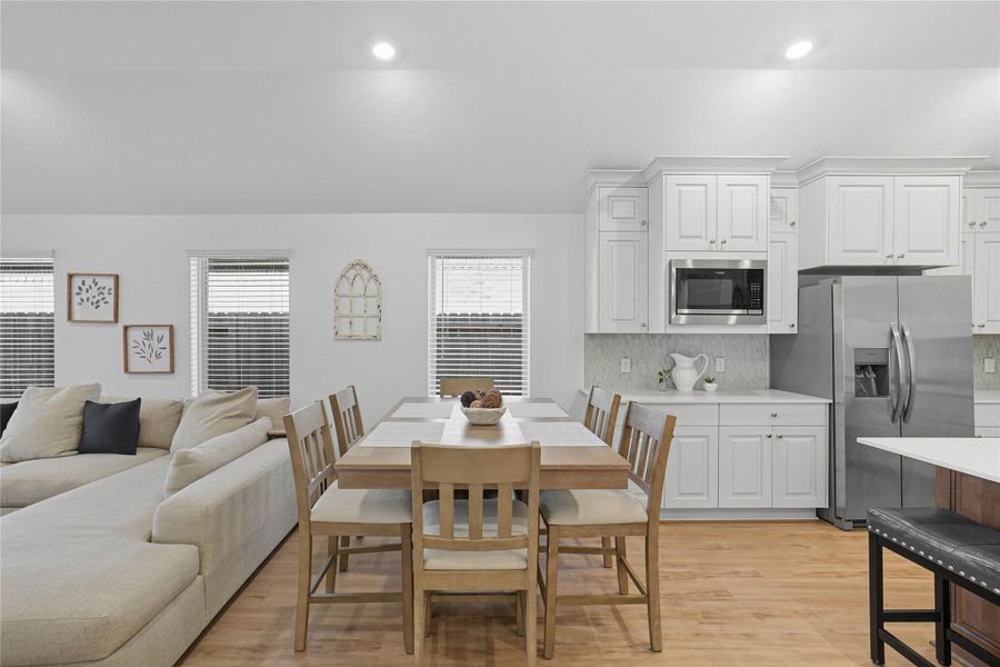 This open-concept home includes a spacious dining area. This open-concept home includes a spacious dining area.