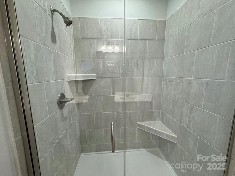 Primary Bathroom Tiled Shower with seat