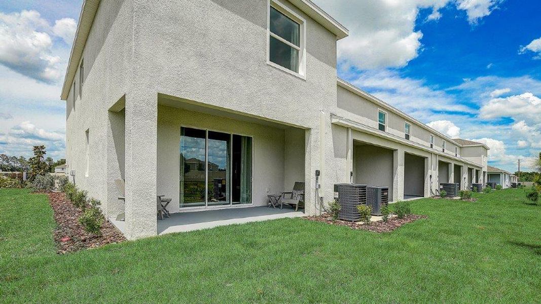 Exterior details and patio area of a home in Woodcreek, Wesley Chapel (Image 4).