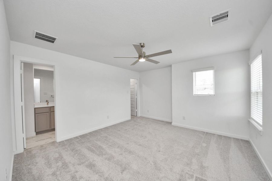 Secondary bedroom features plush carpeting, large windows that let in plenty of natural light, bright paint, and spacious closets. Secondary bedroom features plush carpeting, large windows that let in plenty of natural light, bright paint, and spacious closets.