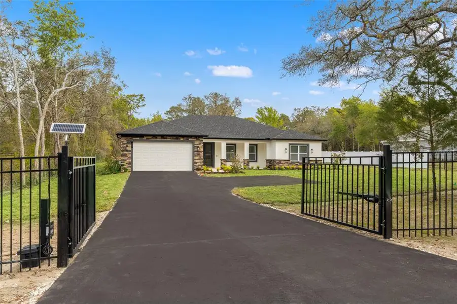 Front exterior of a new home in , Spring Hill, FL, highlighting curb appeal (Image 2). Front exterior of a new home in , Spring Hill, FL, highlighting curb appeal (Image 2).