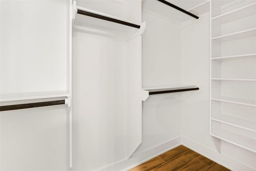 Primary bedroom walk in closet