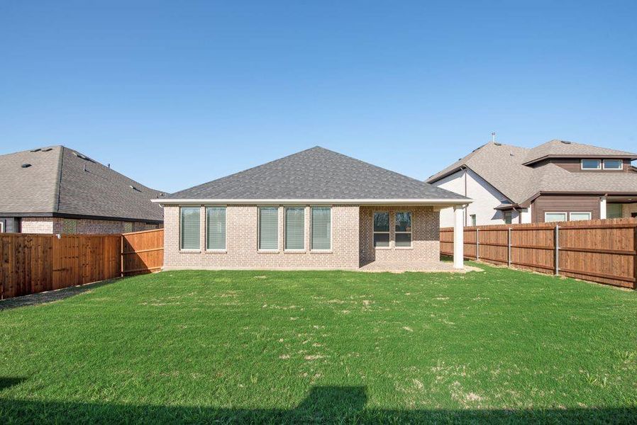 Exterior details and patio area of a home in Wildflower Ranch, Justin (Image 22). Exterior details and patio area of a home in Wildflower Ranch, Justin (Image 22).
