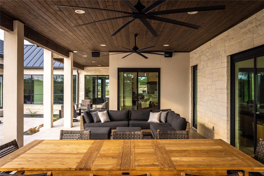 View of patio / terrace with an outdoor living space and ceiling fan