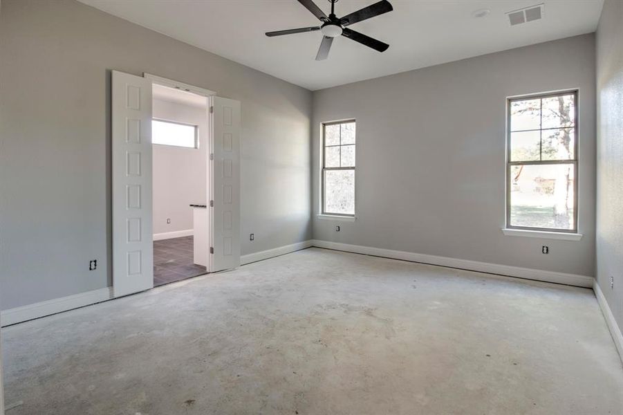 Unfurnished bedroom featuring ceiling fan