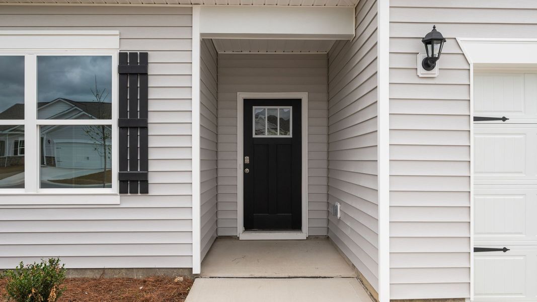 Front exterior of a new home in Villa Grande, Winterville, NC, highlighting curb appeal (Image 2).
