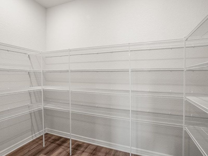 A walk-in pantry provides storage convenience.