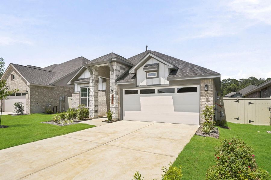 Front exterior of a new home in Audubon, Magnolia, TX, highlighting curb appeal (Image 19).