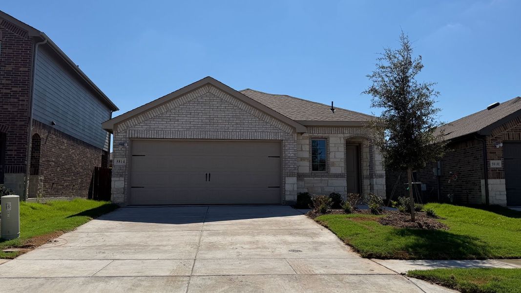 Front exterior of a new home in Wildcat Ranch, Crandall, TX, highlighting curb appeal (Image 1). Front exterior of a new home in Wildcat Ranch, Crandall, TX, highlighting curb appeal (Image 1).