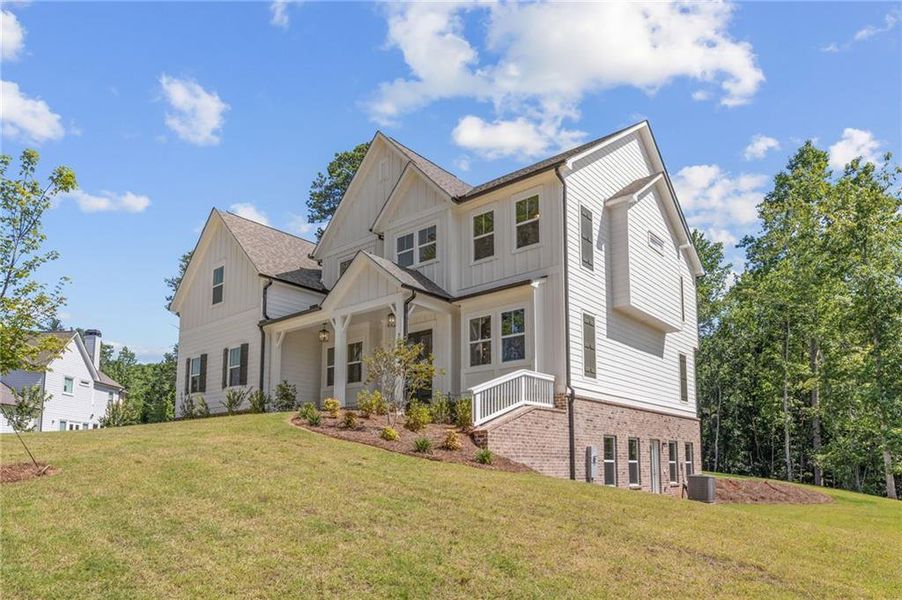 Front exterior of a new home in Chattahoochee Reserve, Cumming, GA, highlighting curb appeal (Image 31).