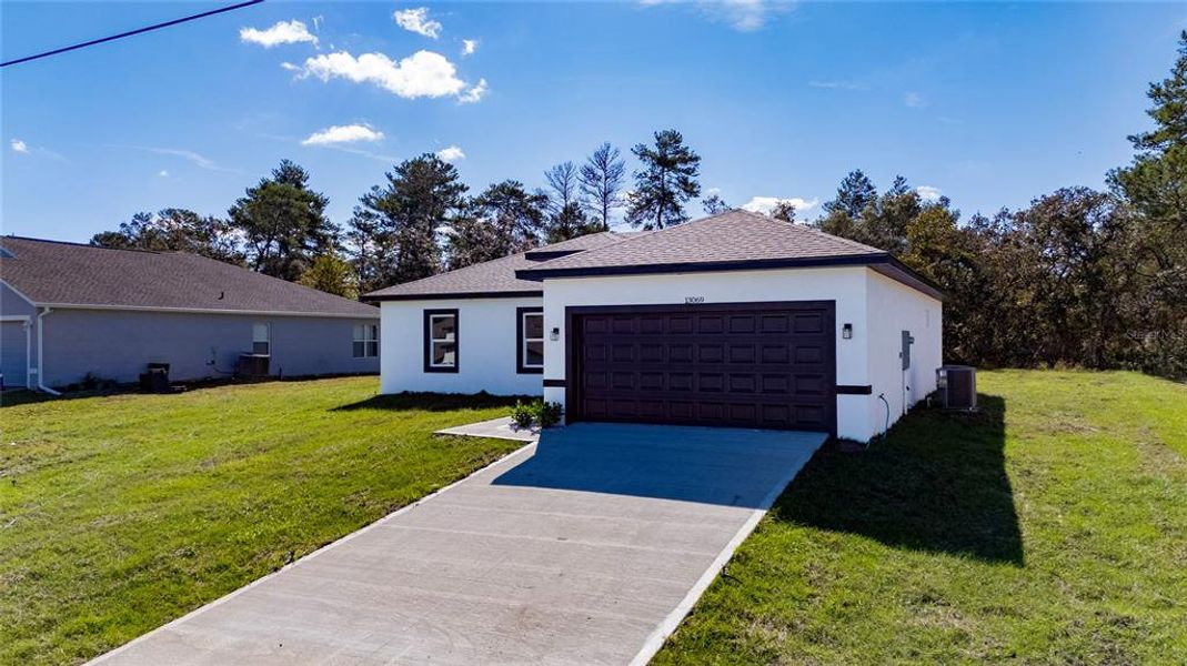 Front exterior of a new home in , Ocala, FL, highlighting curb appeal (Image 22).