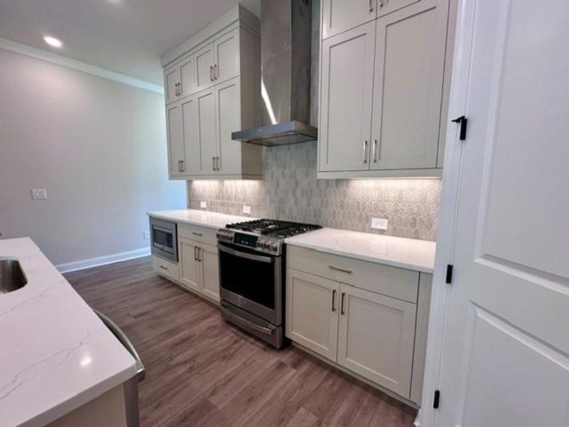 Furnished interior view inside a new home in Ward's Crossing Townhomes, Johns Creek (Image 14).