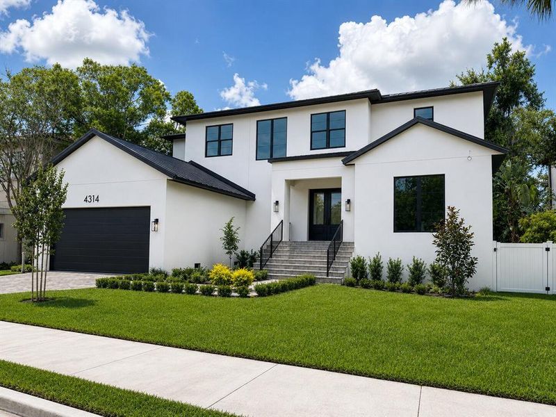 Front exterior of a new home in , Tampa, FL, highlighting curb appeal (Image 1). Front exterior of a new home in , Tampa, FL, highlighting curb appeal (Image 1).