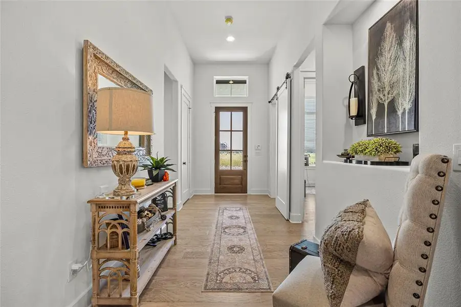 Entryway featuring light hardwood / wood-style floors and a barn door