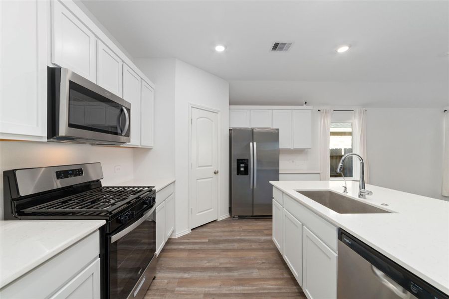 Furnished interior view inside a new home in Sunterra, Katy (Image 7).