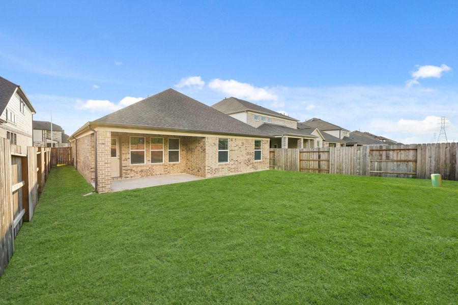 Front exterior of a new home in Sunterra North, Katy, TX, highlighting curb appeal (Image 10). Front exterior of a new home in Sunterra North, Katy, TX, highlighting curb appeal (Image 10).