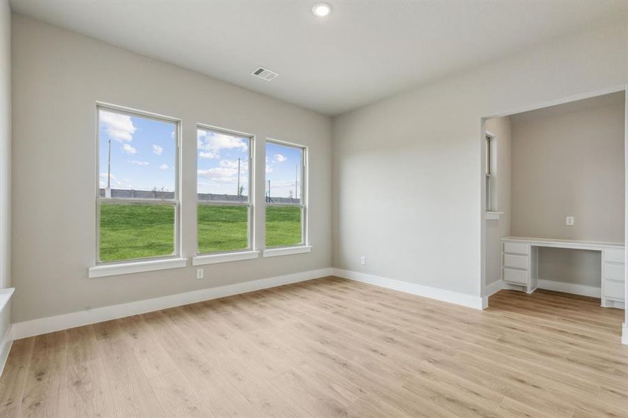 Unfurnished room with light wood-type flooring