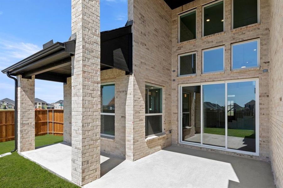Exterior details and patio area of a home in Villages of Creekwood, Frisco (Image 3).