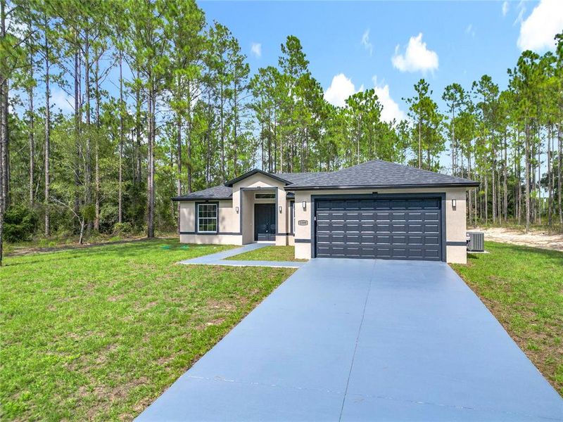 Front exterior of a new home in , Citrus Springs, FL, highlighting curb appeal (Image 21).