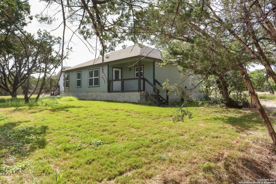 Front exterior of a new home in , Spring Branch, TX, highlighting curb appeal (Image 14).