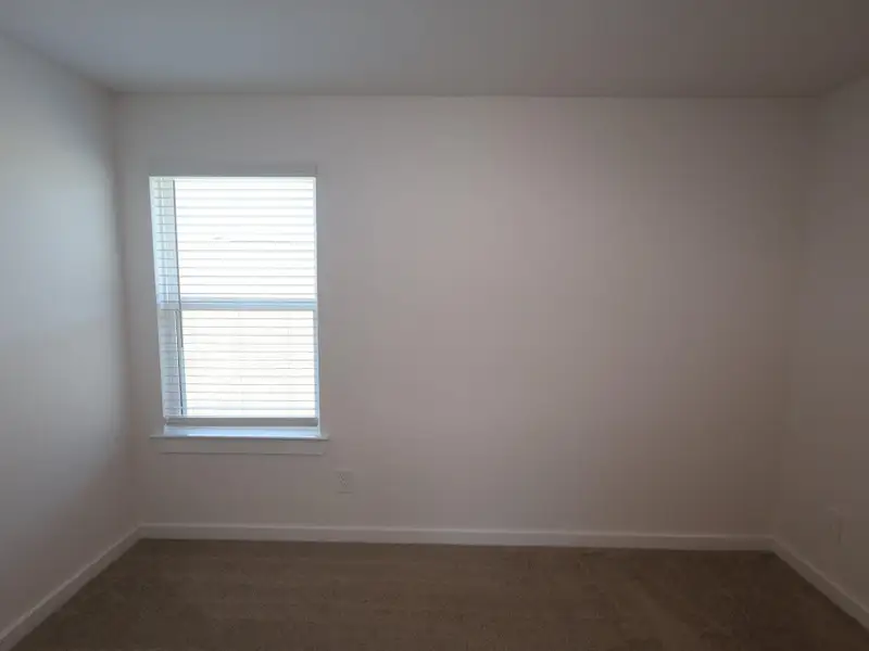 Spacious, unfurnished interior of a new home in Pinewood at Grand Texas, New Caney (Image 12).