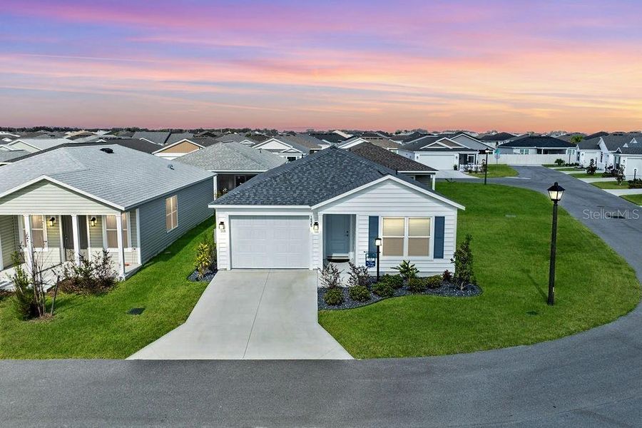 Front exterior of a new home in , The Villages, FL, highlighting curb appeal (Image 1). Front exterior of a new home in , The Villages, FL, highlighting curb appeal (Image 1).