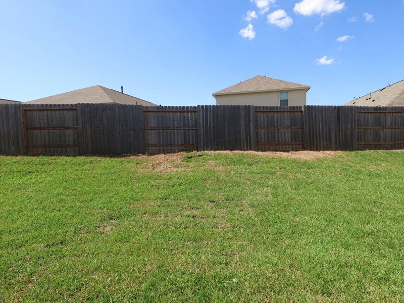Front exterior of a new home in Moran Ranch, Willis, TX, highlighting curb appeal (Image 2). Front exterior of a new home in Moran Ranch, Willis, TX, highlighting curb appeal (Image 2).