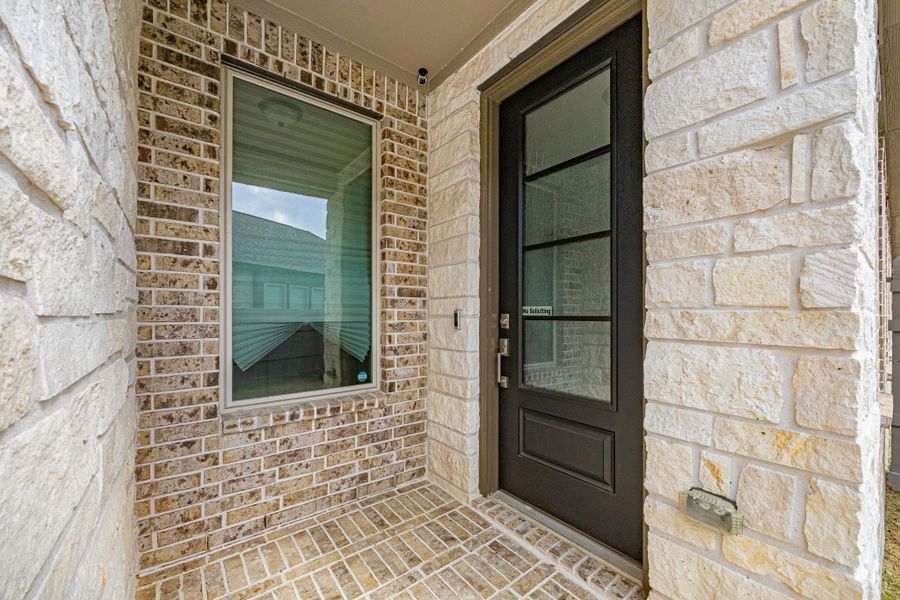 Exterior details and patio area of a home in Artavia: Avante Collection, Conroe (Image 3).