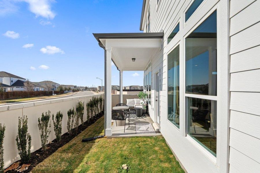 Covered patio with a concrete slab, recessed lighting, and white columns
