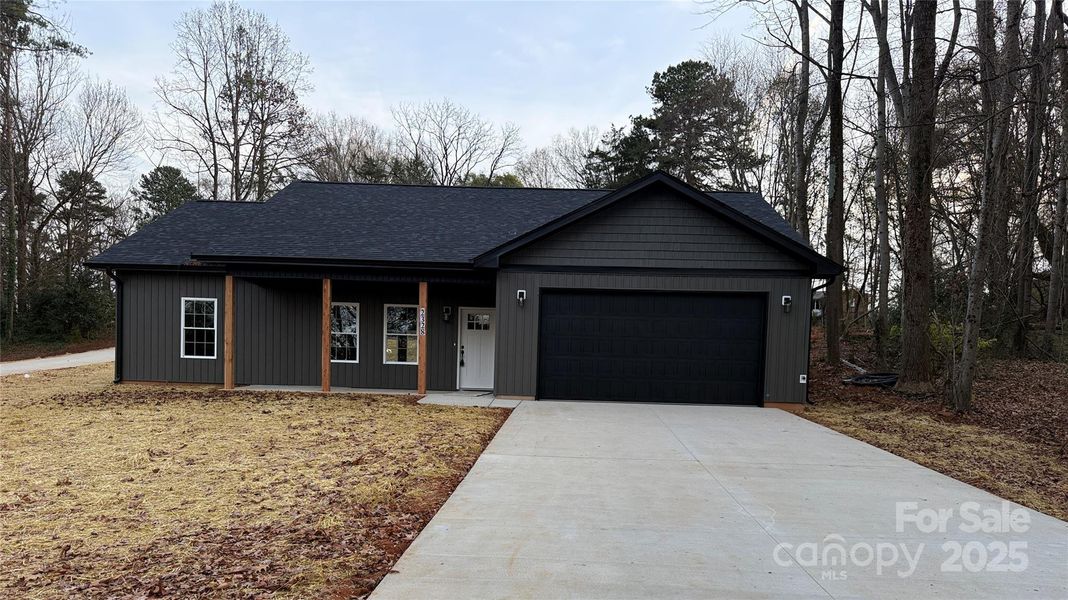 Front exterior of a new home in , Winston-Salem, NC, highlighting curb appeal (Image 1).