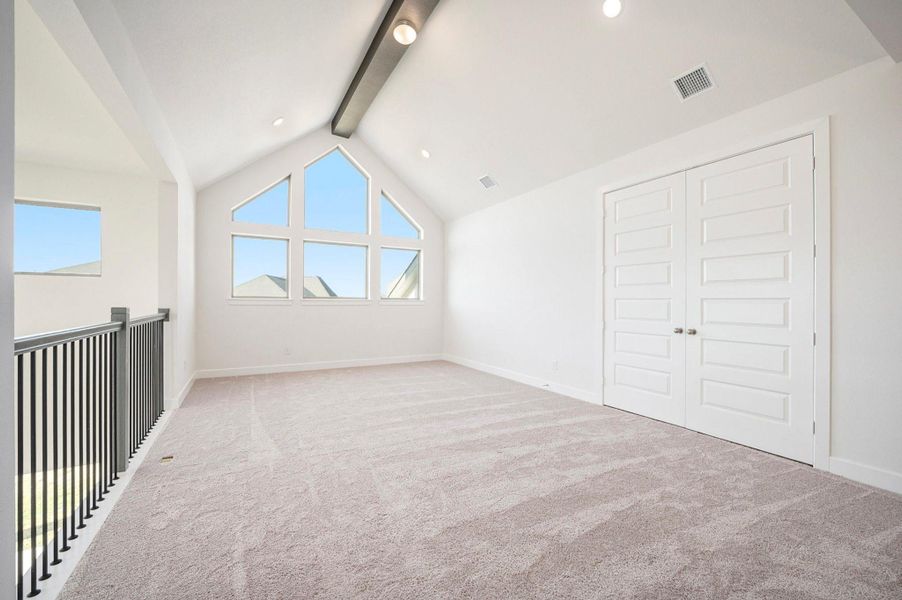 The spacious media room provides the perfect setting for movie nights and entertainment. Designed for comfort and style, this inviting space offers ample room for seating, optimal acoustics, and a cozy atmosphere—ideal for enjoying your favorite films or hosting family gatherings in luxury.