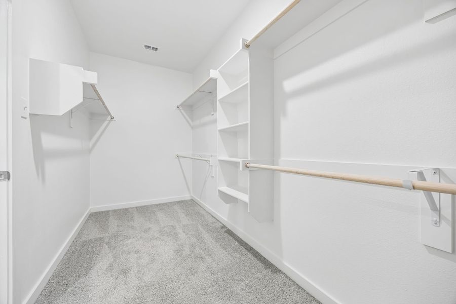 Walk-in closet in the Heisman home plan by Trophy Signature Homes – REPRESENTATIVE PHOTO Walk-in closet in the Heisman home plan by Trophy Signature Homes – REPRESENTATIVE PHOTO