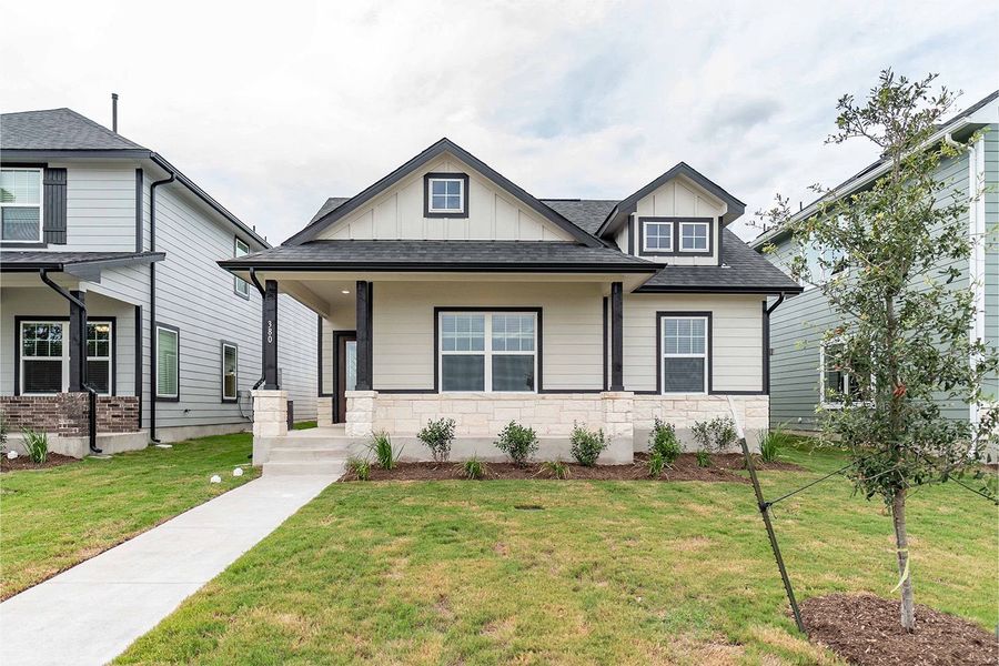 Front exterior of a new home in Paramount, Kyle, TX, highlighting curb appeal (Image 1). Front exterior of a new home in Paramount, Kyle, TX, highlighting curb appeal (Image 1).