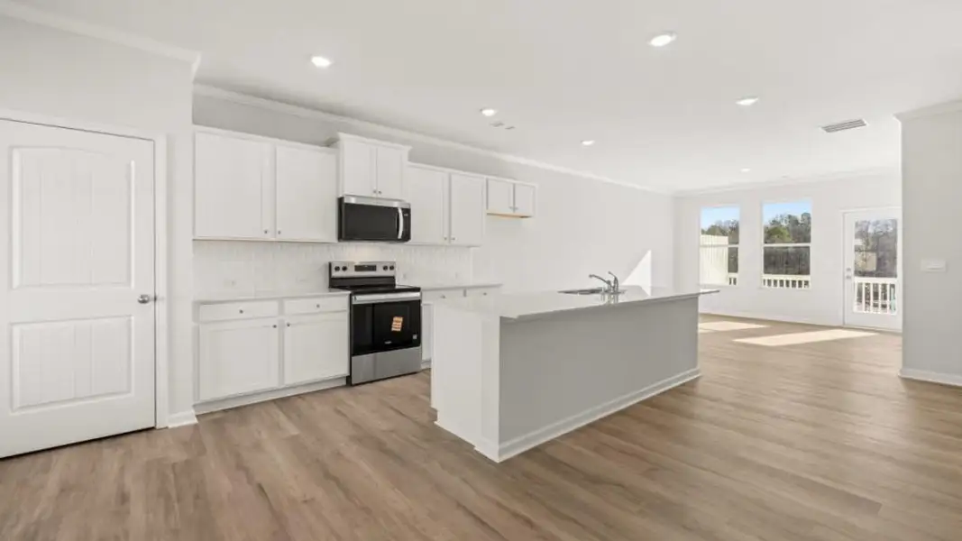 Furnished interior view inside a new home in Waypoint, Flowery Branch (Image 5).