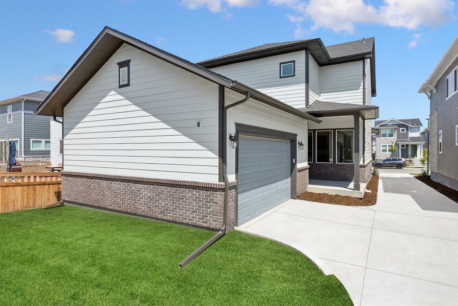 Exterior details and patio area of a home in Painted Prairie Cottage, Aurora (Image 2).