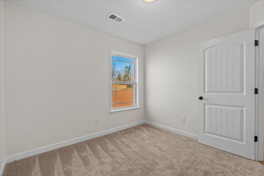 Representative unfurnished interior of a home built from the Cheshire by Enchanted Homes in Hampshire Heights, Moore (Image 27).