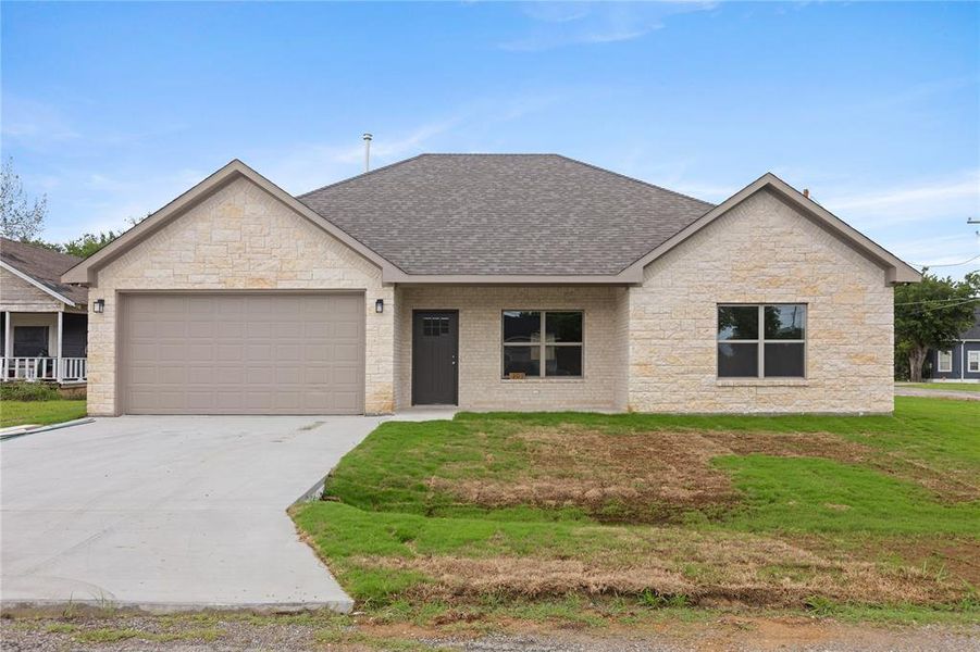 Front exterior of a new home in , Tom Bean, TX, highlighting curb appeal (Image 2). Front exterior of a new home in , Tom Bean, TX, highlighting curb appeal (Image 2).