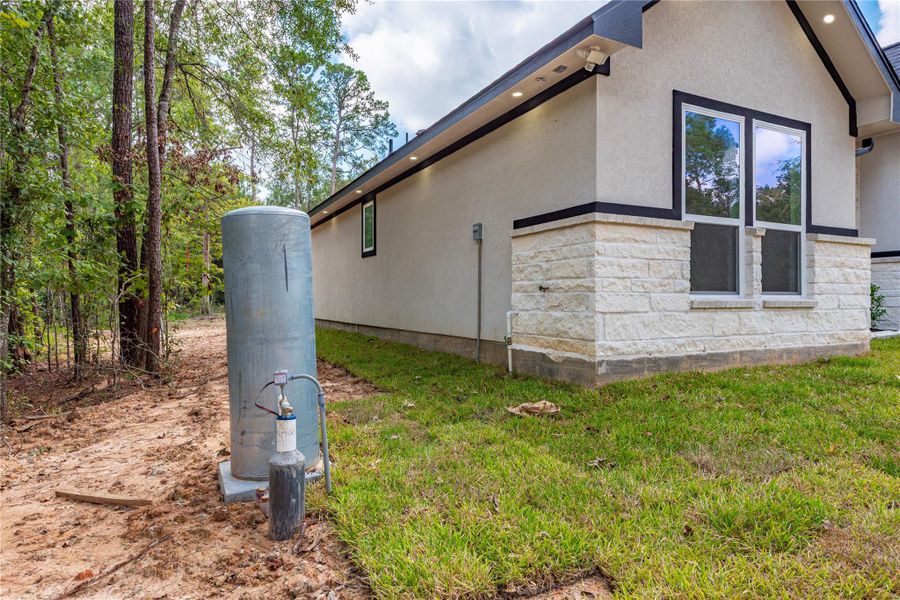 Front exterior of a new home in , Dayton, TX, highlighting curb appeal (Image 21).