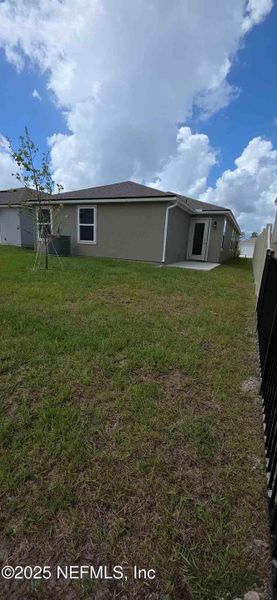 Front exterior of a new home in The Arbors, Jacksonville, FL, highlighting curb appeal (Image 22).