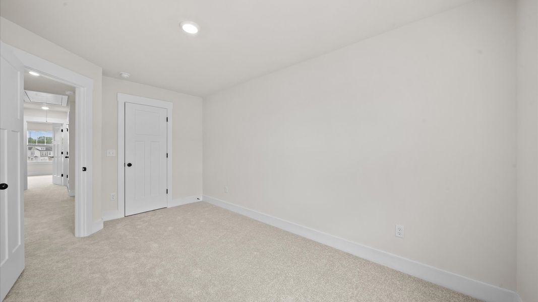 First-class secondary bedroom with comfortable carpeted flooring and generous closet space First-class secondary bedroom with comfortable carpeted flooring and generous closet space