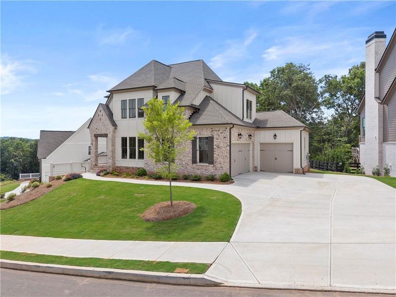 Front exterior of a new home in , Marietta, GA, highlighting curb appeal (Image 2). Front exterior of a new home in , Marietta, GA, highlighting curb appeal (Image 2).