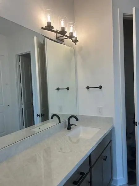 Porcelain vanities in the primary.