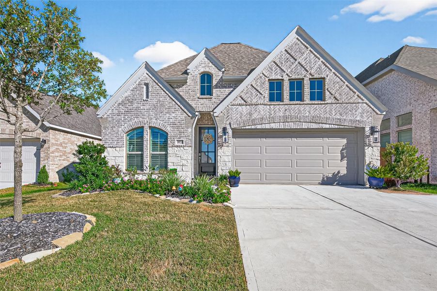 2024 modern home with a beautiful brick and stone exterior color palette. (Note: Photo is staged; property is currently vacant.) 2024 modern home with a beautiful brick and stone exterior color palette. (Note: Photo is staged; property is currently vacant.)